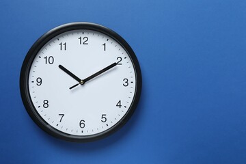 Big beautiful stylish clock on color background
