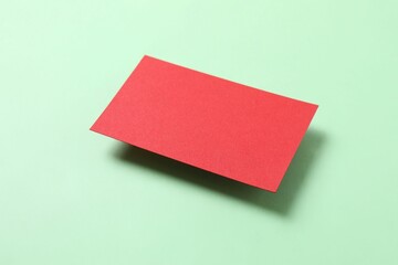 Red paper card on color background