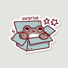 The frog looks out of the box. Surprise sticker. Cute toad in doodle style.