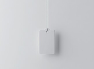 White flat rectangular tag mockup hanging on a string, perfect for branding and product labeling designs.