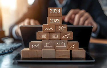 Digital marketing and business development concept with text "2023" on wooden blocks