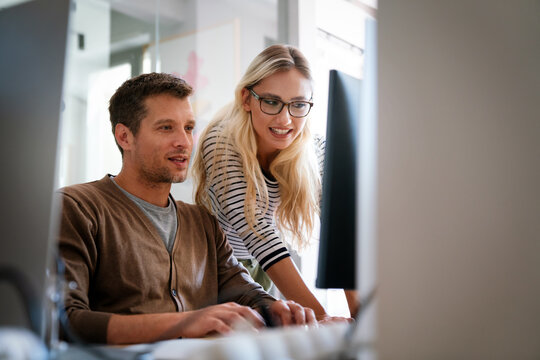 Programmers cooperating at IT company developing apps. Business people technology concept