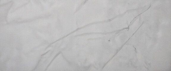 Textured white concrete surface with linear grooves, modern minimalism