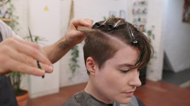 Hairdresser cutting hair in slow motion