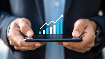 entrepreneurship tips startup scalability resilience A person holds a smartphone displaying a rising graph, symbolizing financial growth and analytics.