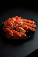 Kamchatka Crab on a Black Tray. Healthy Eating Concept. Selective Focus, Handcrafted Photography, Not AI