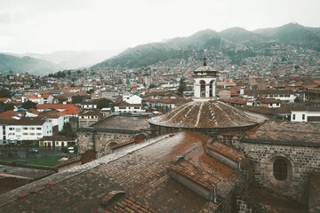Scenic view of Cusco, Peru, with traditional architecture and surrounding mountains