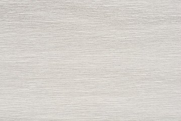 A close-up shot of textured white and gray crepe paper with a subtle, wavy pattern