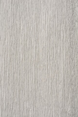 A close-up shot of textured white and gray crepe paper with a subtle, wavy pattern