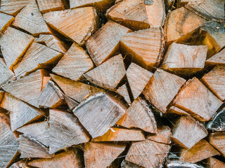 Stack of fire wood. Old style traditional heating material for fireplace or stove. Living in...