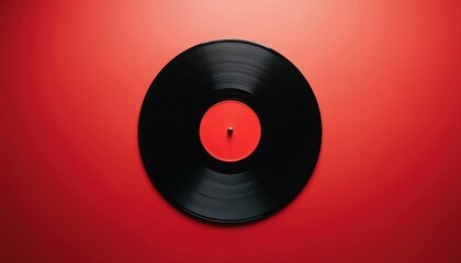 Obraz premium Top view flat lay of black vinyl record. Red label contrasts with grooves. Retro music, sound concept. Minimalist style, vibrant colors and clean design.