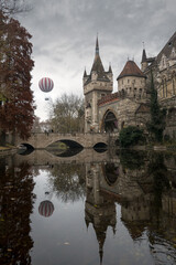 Castle on the lake featuring balloon flying