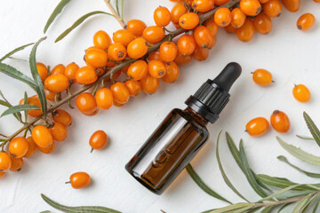 Bright Orange Sea Buckthorn Berries Arranged Creatively With a Glass Dropper Bottle Nearby