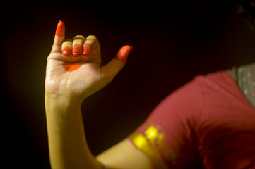 Close up of a female's hand depicting hand gesture called MrugShirsha (Deer head) in Indian classical dance form; Bharatanatyam, India.