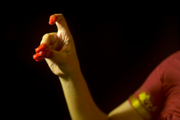 Single Hand gesture called as TamraChud or Cock's comb displayed in Bharatanatyam; an Indian  Classical dance form, India.