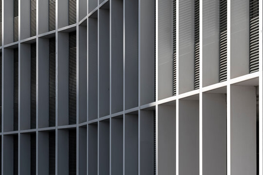 Close-up of contemporary architecture showcasing structured grid patterns and minimalist aesthetics.