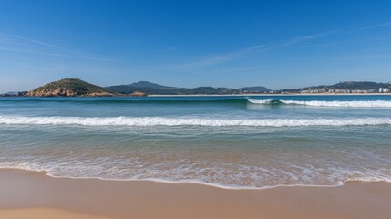 Serene Coastal Beach Scene with Gentle Waves and Lush Landscape