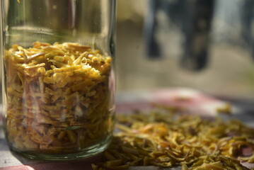 A glass of jar with  citrus peels.