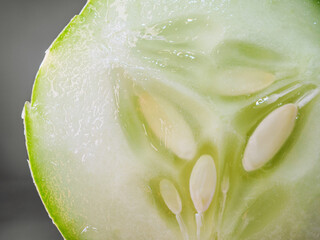 Macro of slices cucumber on black background, close-up of slices cucumber