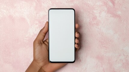Blank Smartphone Display in a Hand Against a Soft Pink Background