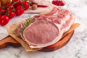 Raw potk loin steak with bone