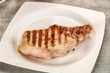 Grilled pork loin steak with bone