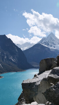 Vertical image of Lake Par&oacute;n, the largest turquoise lake in the Cordillera Blanca, located in the Peruvian Andes, with the Artesonraju mountain peak (aka &ldquo;Paramount&rdquo;)