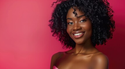 Fototapeta premium Black woman poses gracefully from the waist up, showcasing her beautiful curly hair and warm smile. International Women's Day. Singles Awareness Appreciation
