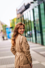 Fototapeta premium Attractive mid aged woman walking in city street