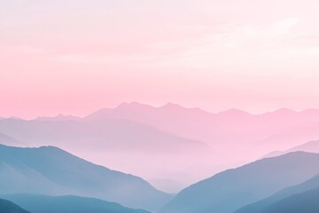 Obraz premium Pink sunrise over misty mountain range, serene landscape