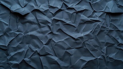 A closeup of crumpled black paper showcasing intricate wrinkles and worn corners, layered with dusty cardboard textures, evoking a sense of age and nostalgia, moody atmosphere