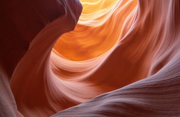 Inside Antelope Canyon, Arizona, USA, wavy sandstone formations create stunning natural patterns. Light filters through slot canyon, casting shadows, color contrast on curved rock walls.