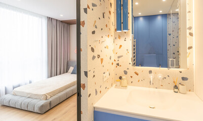 Luxury bathroom features basin, toilet bowl and bathtub