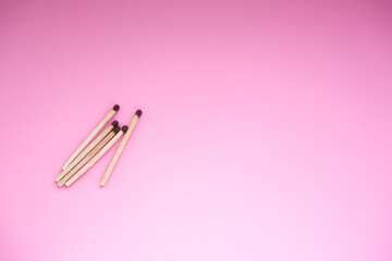 Matches on a pink background. There is a space for the text.The background for the holiday of the day of the match.
