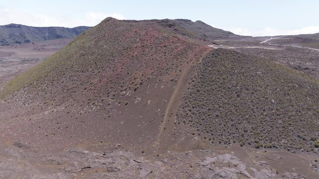 France - Reunion Island - Piton de la Fournaise - Forward view to a red crater on the plaine des sables