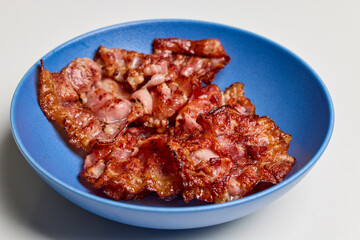 fried bacon on a plate ready to eat