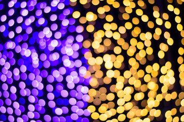 Abstract bokeh lights in purple and yellow hues