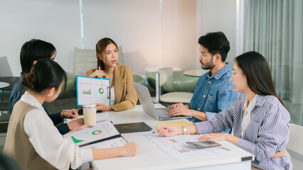 Collaborative business meeting with diverse professionals discussing data analysis and strategies. Engaged team members share insights and ideas. Leader Teamwork stratup
