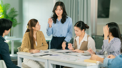 business meeting with diverse group discussing strategies. leader presents ideas while team members engage attentively. Leader Teamwork stratup