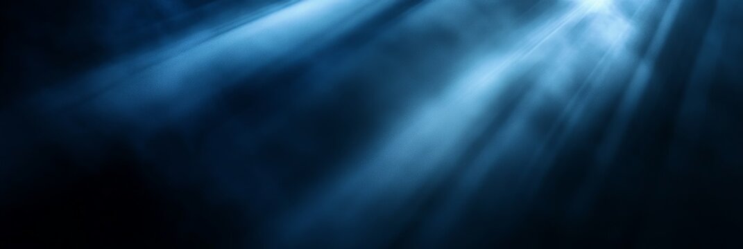 Blue light rays through dark smoke, abstract background for design