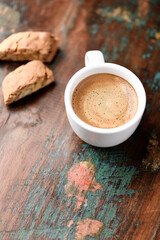 Cup of coffee and Cantuccini (Italian cookie) on dark wooden background. Copy space.