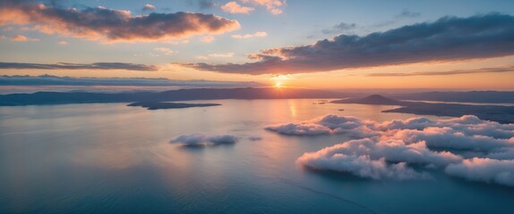 Obraz premium Aerial View of Serene Sunrise Over the Bay with Soft Altocumulus Clouds and Reflected Light on Calm Waters.