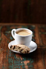 Cup of coffee and Cantuccini (Italian cookie) on dark wooden background. Copy space.	