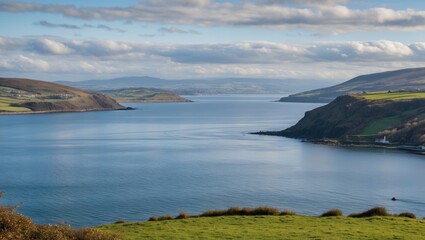 Scenic View of Belfast Lough from Helens Bay Surrounded by Lush Green Hills and Peaceful Waters Under a Cloudy Sky