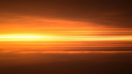 Fototapeta premium Stunning sunset with vibrant orange and gold hues reflecting off a calm water surface, creating a tranquil and mesmerizing atmosphere.