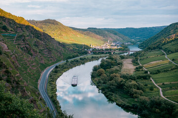 Barge Sailing Through the Moselle River Near Calmont Vineyards