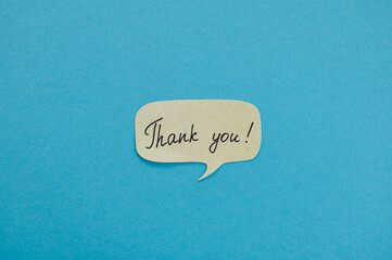 A sticky note with the word Thank you. Motivational words for personal growth, inspiring handwriting on sticky notes