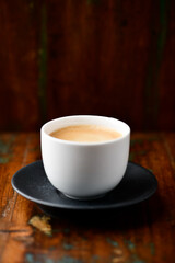 Cup of coffee on wooden background. Soft focus. Copy space.	