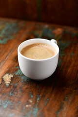 Cup of coffee on wooden background. Soft focus. Copy space.	