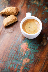 Cup of coffee and Cantuccini (Italian cookie) on dark wooden background. Copy space.	